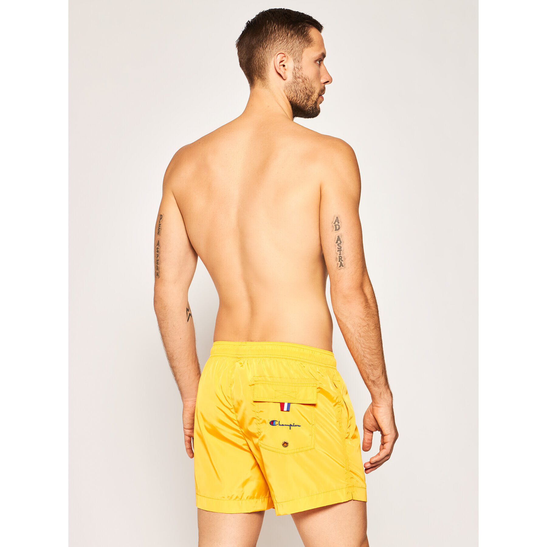 Champion Plavecké šortky Small C Logo Swim 214453 Žlutá Regular Fit - Pepit.cz