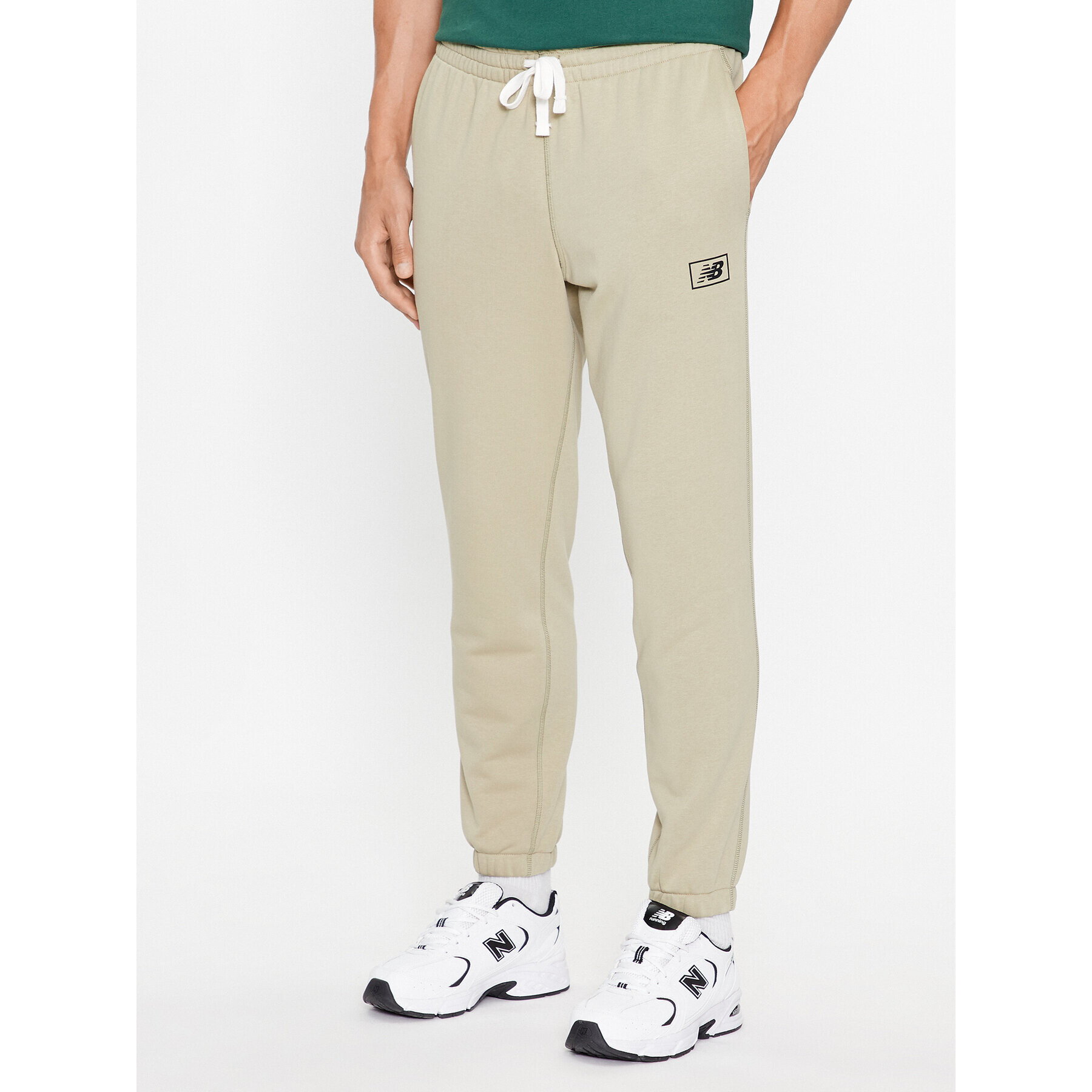 New Balance Teplákové kalhoty NB Essentials Sweatpant MP33509 Zelená Regular Fit - Pepit.cz