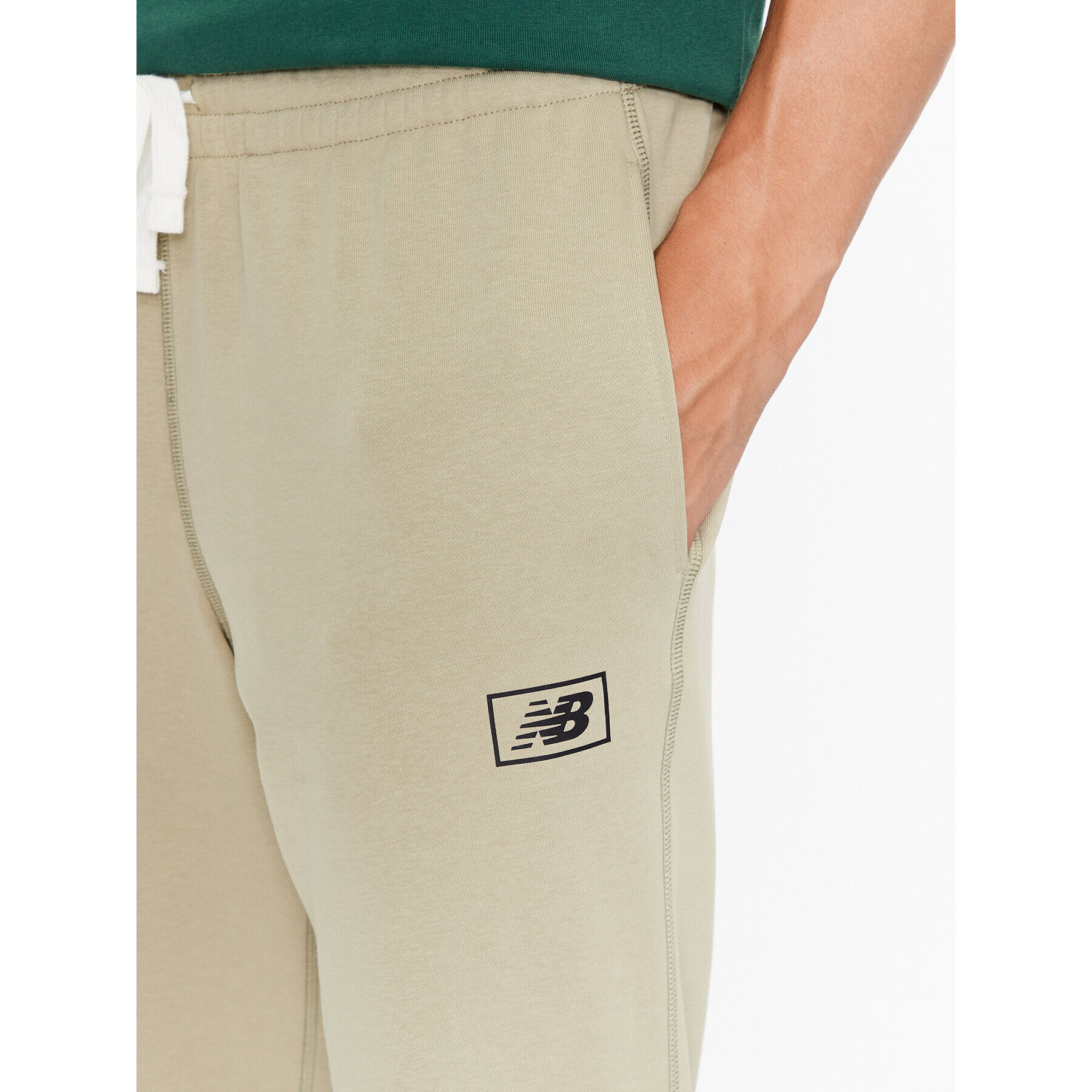 New Balance Teplákové kalhoty NB Essentials Sweatpant MP33509 Zelená Regular Fit - Pepit.cz