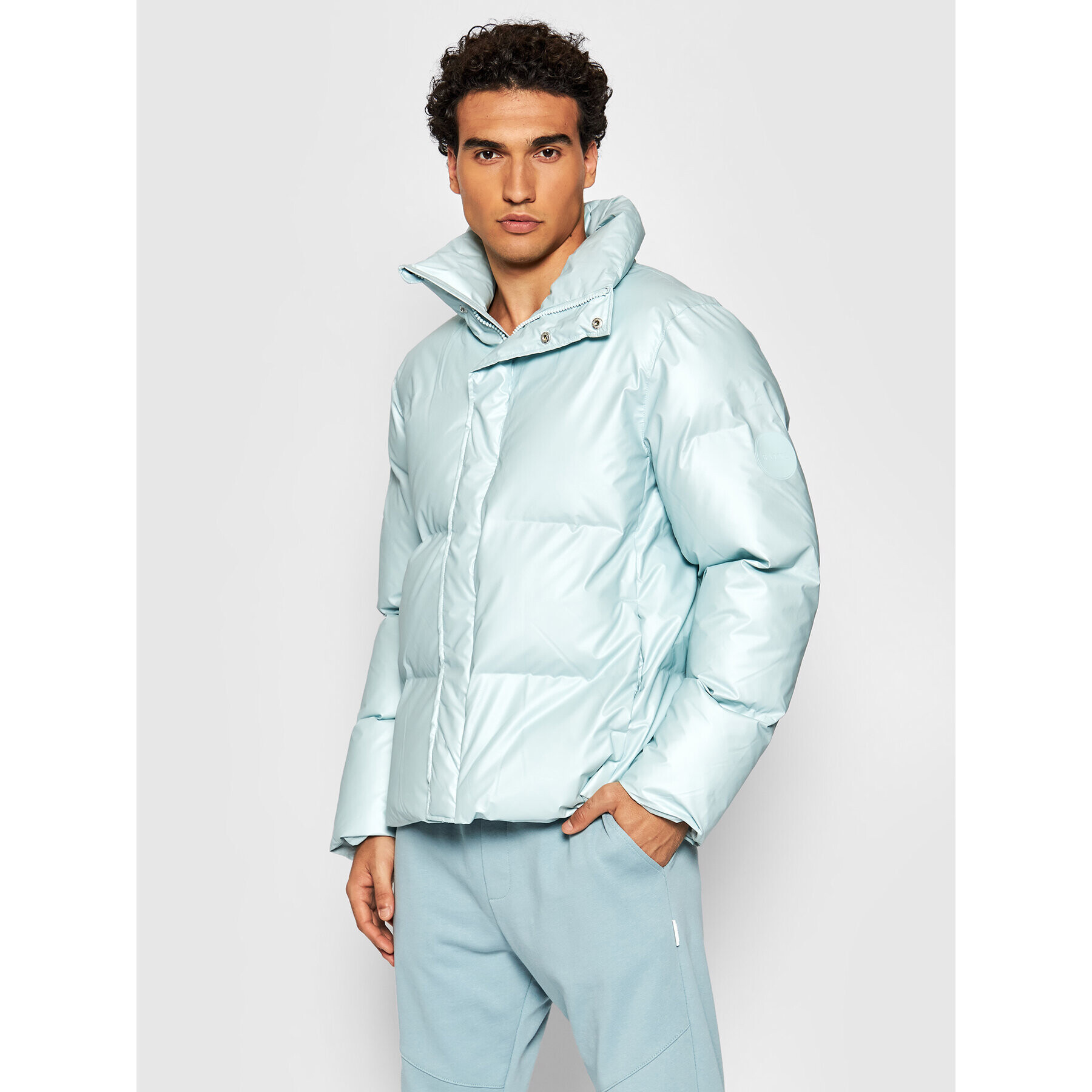 Rains Vatovaná bunda Unisex 1522 Modrá Boxy Fit - Pepit.cz