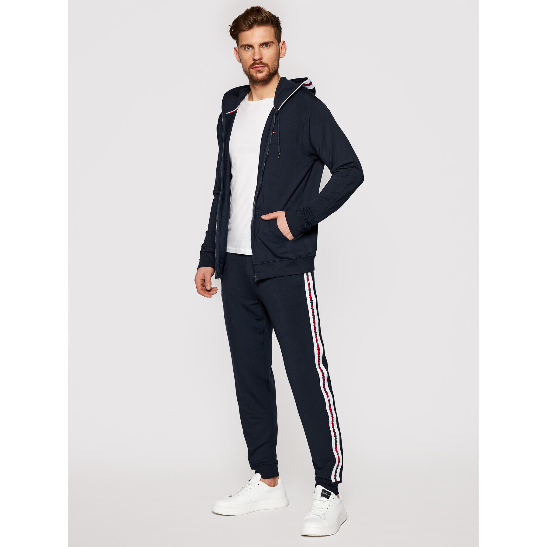 Tommy Hilfiger Teplákové kalhoty Repeat Logo UM0UM01918 Tmavomodrá Regular Fit - Pepit.cz